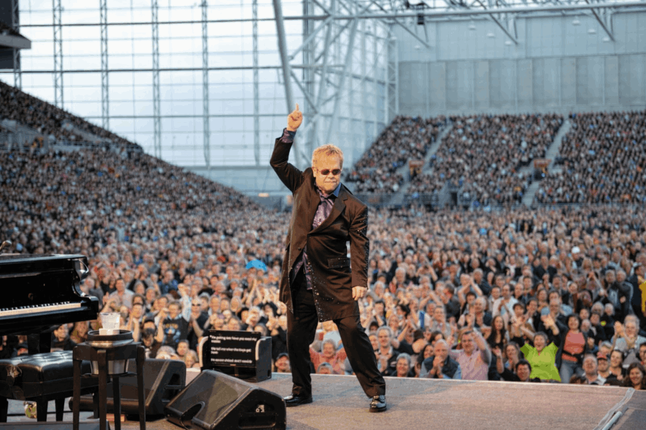 Sir Elton John performing to a sold-out crowd at Forsyth Barr Stadium Dunedin — produced by KnotArt Capital C Concerts, part of five New Zealand tours totalling 134,000 audience members